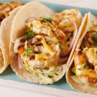 Shrimp Street Taco - (3) · Grilled buttery shrimp topped with special sauce, shredded cheese wrapped in a floor tortilla