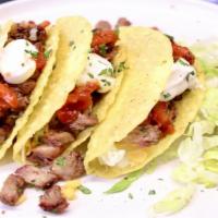 Grilled Steak Taco (3) · Grilled Steak topped with lettuce, tomatoes, onions special sauce, shredded cheese wrapped i...