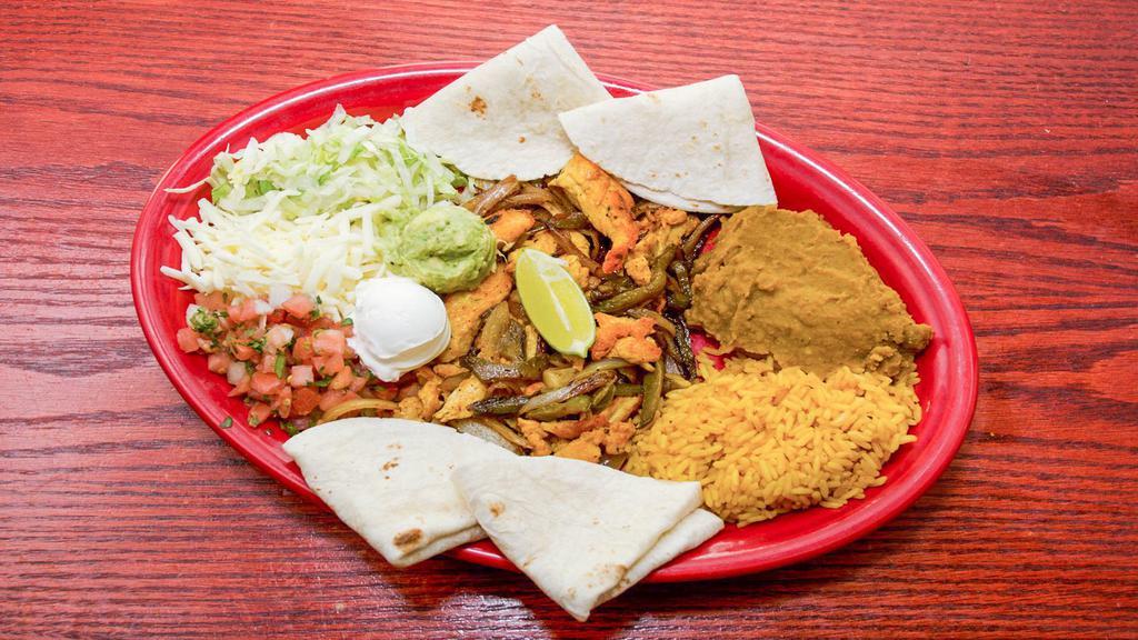 Chicken Fajitas · Hand trimmed chicken, marinated and saute'd with fresh peppers and onions.