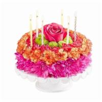 Birthday Cake Of Flowers · Deluxe. Non-edible cake made of fresh flowers. Designer's choice color scheme.

includes:
ca...