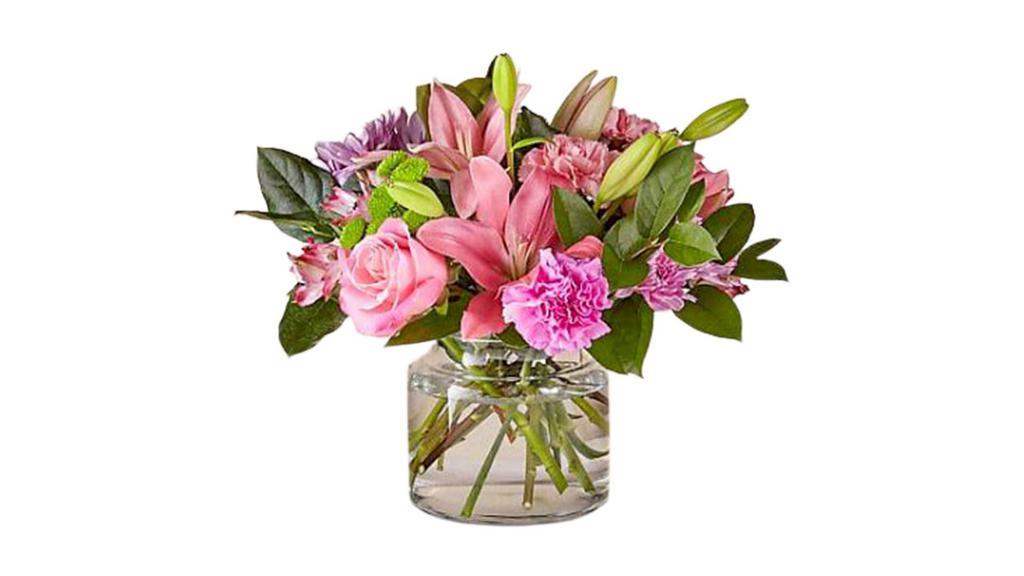 Butterfly Bouquet · Pink lilies, pink roses, pink carnations, and lavender mums and lemon leaf greenery.