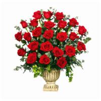 Regal Roses Urn · Deluxe. A beautiful Grecian urn filled with red roses and greenery. This funeral arrangement...