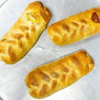 Make Your Own Pizza Roll · Choose up to four toppings. Add extra toppings for an additional charge.