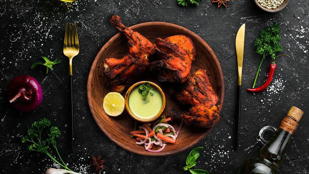 Chicken Tandoor (4 Pcs) · Bone-in chicken marinated in yogurt and house spices cooked to perfection in an Indian clay oven.