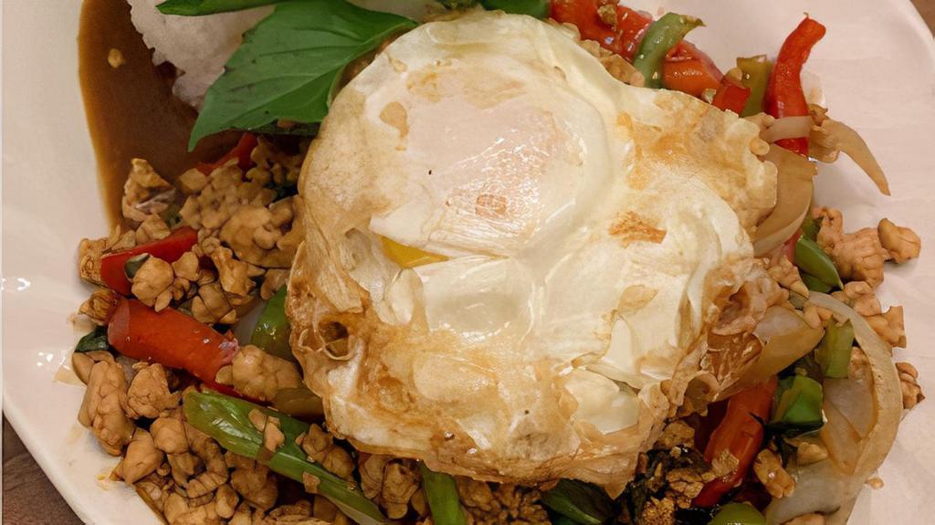Ka Praw Basil · Mince chicken stir fried with bell peppers, onion. And Thai basil in brown sauce. Served with fried egg on top.