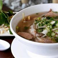 Pho Beef & Meatball · Rice noodle in beef broth with beef slices and meatball topped with onion & cilantro.
