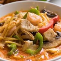 Gang Gai · Red curry and coconut milk stir fried with bell peppers, mushroom, and bamboo shoot.