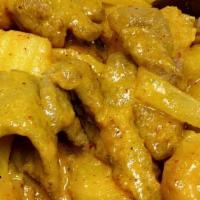 Gang Karee · Yellow curry coconut milk stir fried with potato, green onion & white onion.