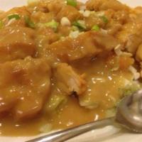 Wor Shu Gai · fried white meat patties with yellow gravy on top
