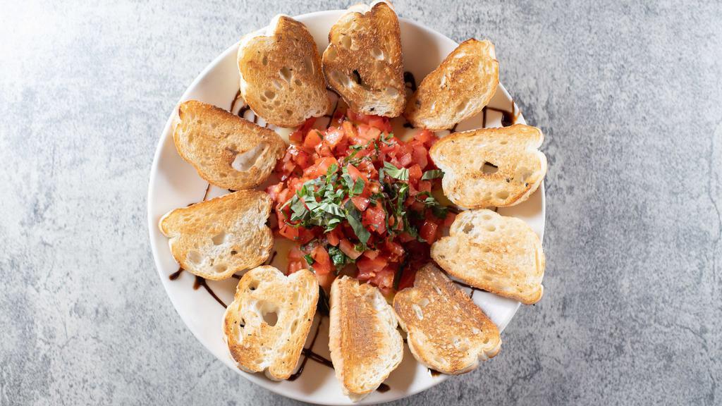 Bruschetta · Diced roma tomatoes, fresh basil, garlic, and extra virgin olive oil blended together. Served with crostinis.