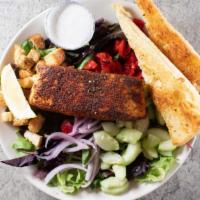 Blackened Salmon Salad · Mixed greens topped with a blackened, spiced-rubbed salmon filet. Cucumbers, red onions, roa...