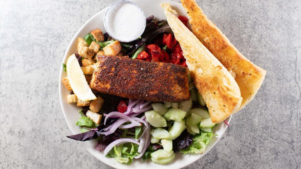 Blackened Salmon Salad · Mixed greens topped with a blackened, spiced-rubbed salmon filet. Cucumbers, red onions, roasted red peppers and croutons. Served with sour cream and dill dressing.