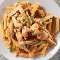 Shrimp Diavolo Pasta · A spicy combination of shrimp, chicken and chorizo in a heavy cream, crushed red pepper sauc...