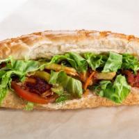 Pita Veggie Sandwich · Lettuce, onions, tomatoes, green pepper, feta cheese and Greek dressing on a pita. VG
