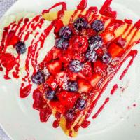 Mixed Berries And Cream Crepe · Whipped cream, strawberries, raspberries, blueberries, served with raspberry drizzle and pow...