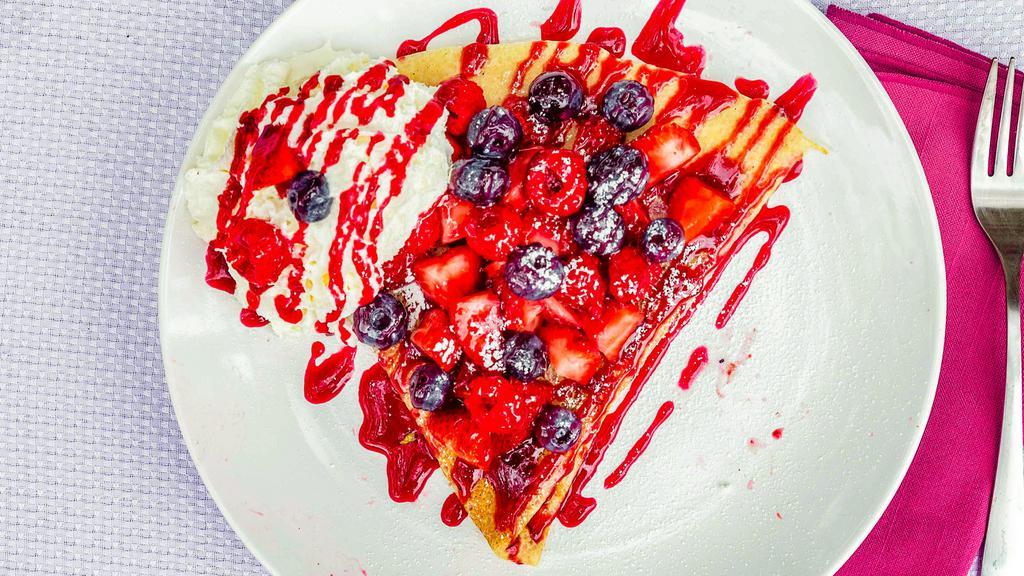 Mixed Berries And Cream Crepe · Whipped cream, strawberries, raspberries, blueberries, served with raspberry drizzle and powdered sugar.