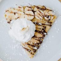 Banana And Nutella Crepe · Bananas, Nutella, whipped cream and Nutella drizzle.