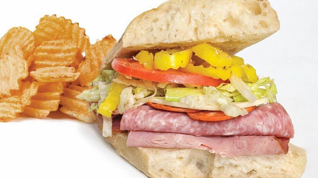 Italian Sub · Salami, ham, pepperoni and provolone cheese topped with banana peppers, shredded lettuce, Parmesan cheese and Buddy’s Sicilian spice blend served on an Italian roll with Buddy’s Famous Vinaigrette.