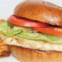 Italian Chicken Sandwich · Marinated grilled chicken breast topped with provolone cheese, lettuce, tomato on a brioche ...