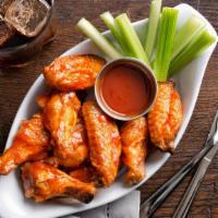 Chicken Wings · Seven wings. Served with celery sticks and dressing.
