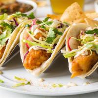 Fish Taco Dinner · Three tacos served with rice and beans.