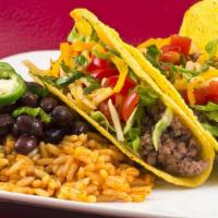 Three Taco Dinner · Three tacos served with rice and beans.