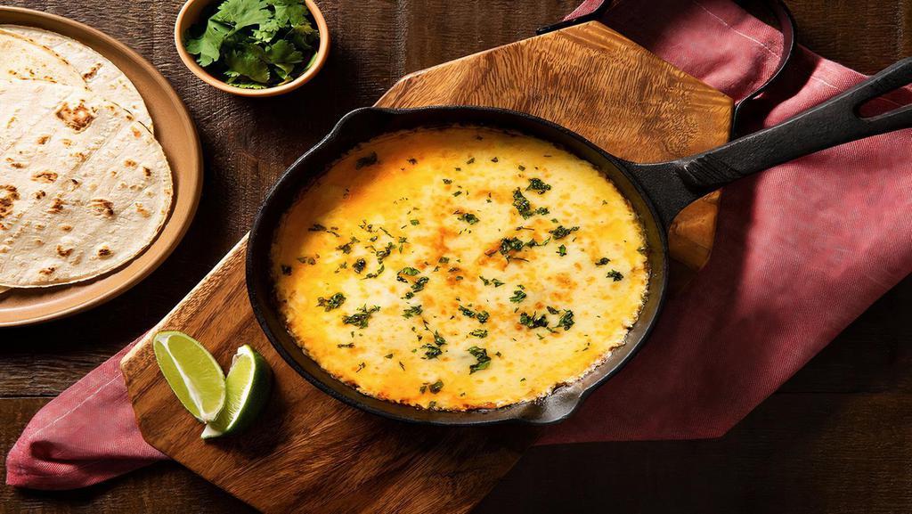 Queso Fundido · Tortilla and melted cheese.