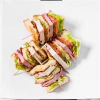 Club Sandwich · Turkey, bacon, ham, lettuce, tomato and mayo on a toast.