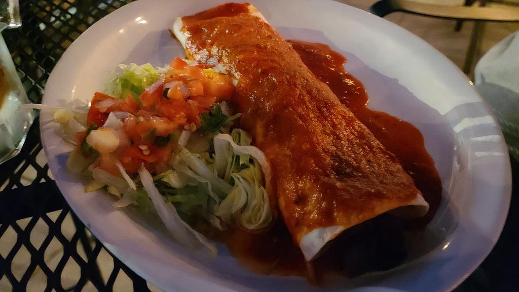 Burrito Chile Colorado · Grilled steak simmered in colorado sauce, rolled with beans in a large ﬂ our tortilla and smothered with more colorado sauce. Served with rice, lettuce and pico de gallo.