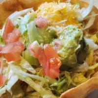 The Classic Taco Salad · A ﬂour tortilla shell with your choice of shredded beef, chicken or ground beef with lettuce...