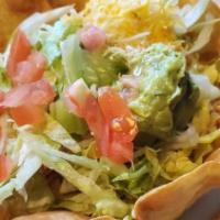 Fajita Taco Salad · A crispy ﬂour tortilla with your choice of steak or chicken with sautéed bell pepper, onion ...
