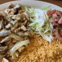 Pollo Supremo · Strips of chicken breast smothered with onion, mushrooms and spices simmered in sour cream s...