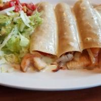 Enchiladas Del Mar · Four fresh corn tortillas stuffed with crab meat, shrimp, onion and tomato, glazed with chee...