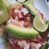 Shrimp Ceviche · Premium shrimp cured in lime juice and fresh spices. Served with chopped tomato, mango, onio...