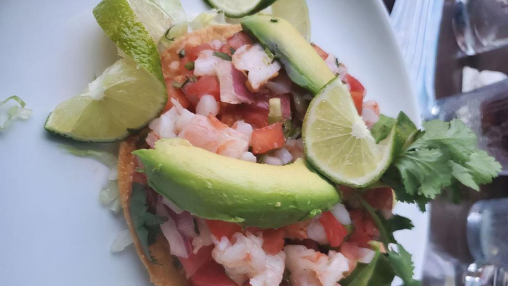 Shrimp Ceviche · Premium shrimp cured in lime juice and fresh spices. Served with chopped tomato, mango, onion, jalapeño peppers and cilantro. Topped with ripe avocado.
