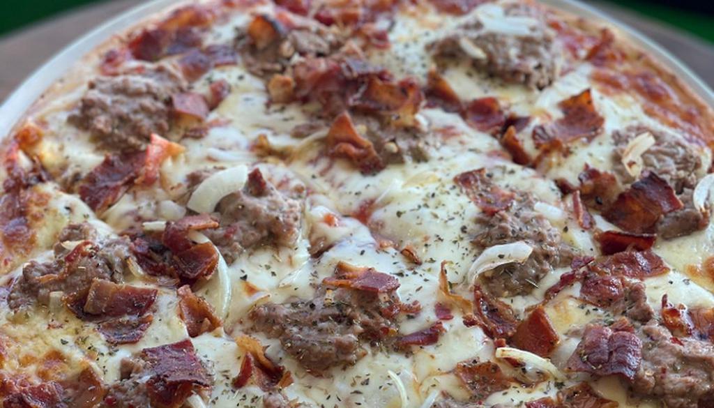 Holly'S Pizza · House BBQ sauce, sausage, bacon, and onions.