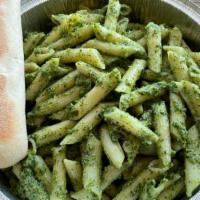Pesto Pasta · Penne noodles covered in a classic pesto sauce. Served with a cheese filled breadstick.