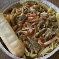 Cajun Pasta · Penne pasta topped with our made from scratch cajun sauce and  served with a cheese filled b...