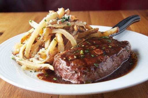 Steak Frites · Marinated USDA Choice Angus, Maitre D'Butter, Red Wine Demi Sauce, Hand-cut French Fries