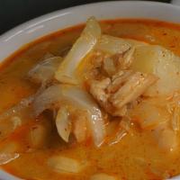 Massaman Curry · Mild, slightly sweet curry with potato, onions, curry paste and coconut milk, topped with pe...