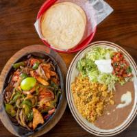 Lunch Fajitas · Grilled chicken or steak, cooked with tomatoes, onions bell peppers. Served with rice, beans...
