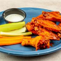Buffalo Wings · 8 wings served with celery, carrots, and your choice of ranch or blue cheese.