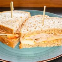 Box Lunch - Apple Turkey Sandwich · Deli turkey, sliced apples, Swiss, housemade honey mustard on wheat bread. Includes bag of c...