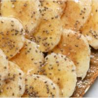 Choco-Nana Toast · Gluten-Free Bread, Almond Butter, Chocolate Drizzle, Sliced Banana, Hemp Seeds, Cinnamon