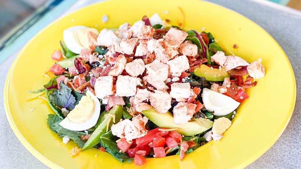 Dr Bob'S Cobb Salad · Grilled chicken, cheddar cheese, blue cheese, tomato, avocado, hard-boiled egg, and chopped bacon.