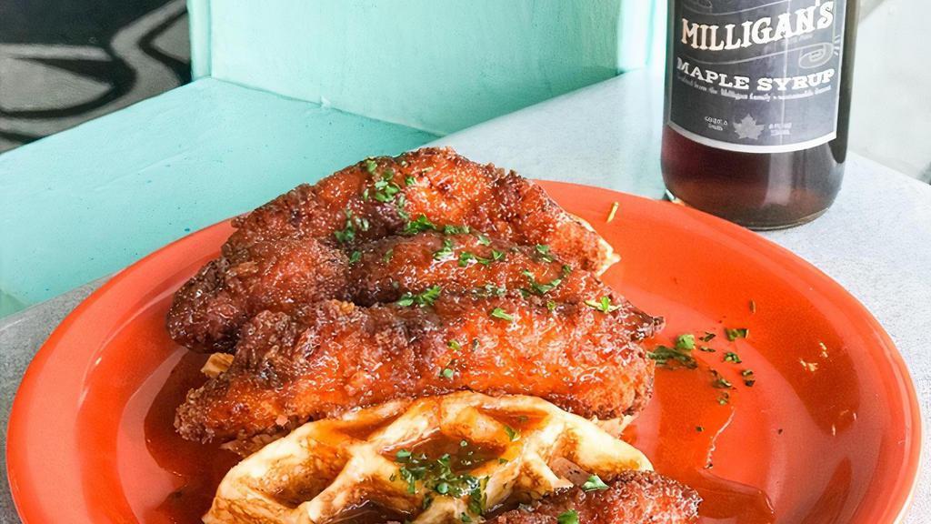 Chicken & Waffles · Fried chicken tenders tossed in a sweet and spicy maple glaze served on top of a buttermilk waffle.