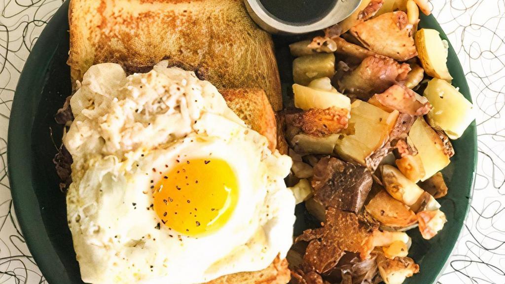 Whole Lotta Goodness · Two slices of french toast topped with a sausage patty, swiss cheese spread and a sunny side egg. Served with HOE fries.