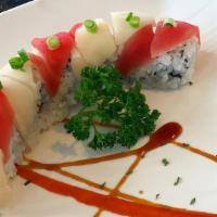 Candy Cane Roll (8Pcs) · Spicy Tuna Roll. Topped with escolar and tuna. Items may contain raw and/or undercooked fish...