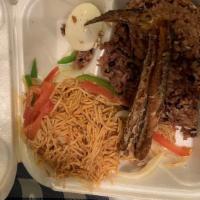 Ayimolou And Fried Fish · Rice cooked with black-eyed peas. With fried fish, angel hair noodles topped with mixed vegg...