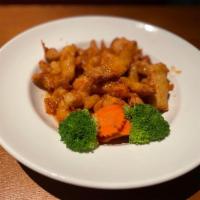 Spicy Sesame Chicken /W Rice · Crispy white meant chicken, broccoli, carrot, spicy sesame orange honey sauce.